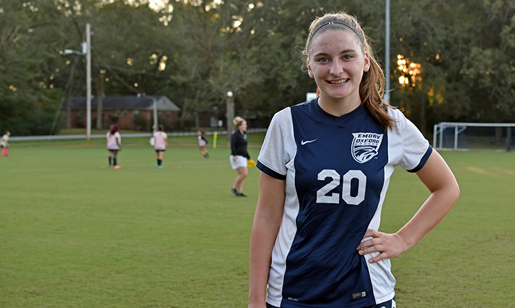 Annie Chappell wears the No. 20 jersey, the same as her dad's baseball number at Emory.