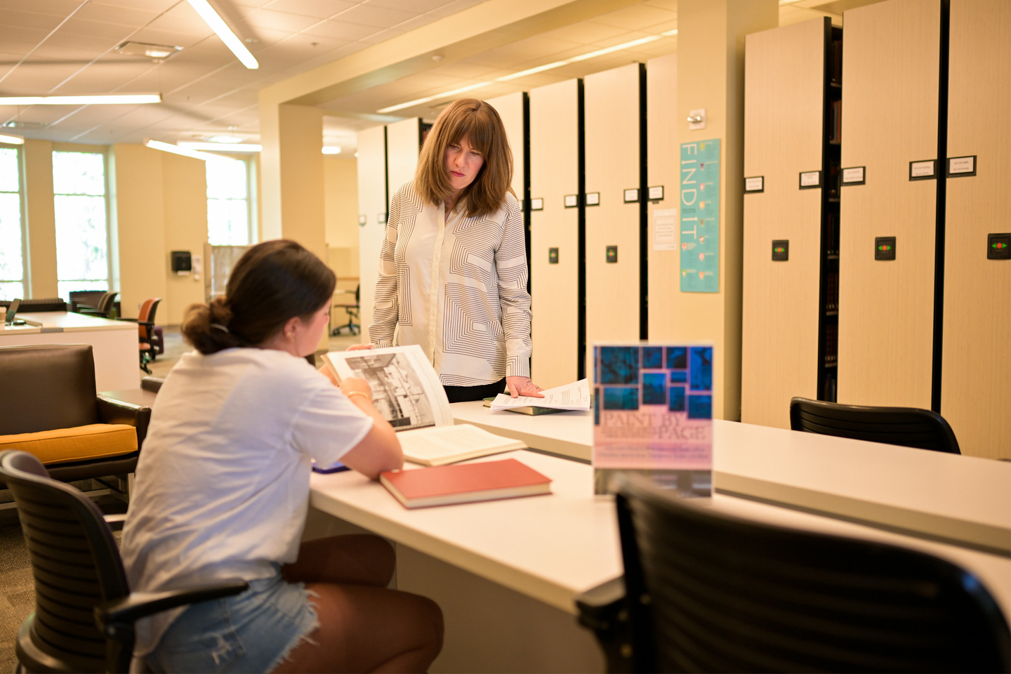 Mary Johnson, recruited through the Arts and Humanistic Inquiry initiative in 2024 as an assistant professor of art at Oxford College, brought her Introduction to Painting students to the Oxford Library where they researched paintings.
